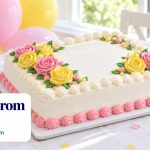 A white sheet cake decorated with pink and yellow buttercream roses on a party table with balloons, with the headline Cakes From $17.47